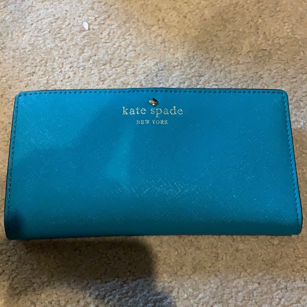 Kate Spade teal slim Cameron slim bifold wallet.